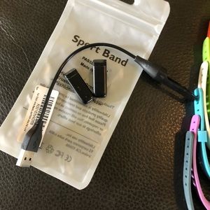 Two Fitbit Flex trackers, charger and 39 bands